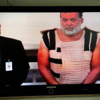 Colorado Springs shooting suspect, Robert Dear, right, appears via video before Judge Gilbert Martinez on Monday with public defender Dan King, at the El Paso County Criminal Justice Center for this first court appearance. | AP