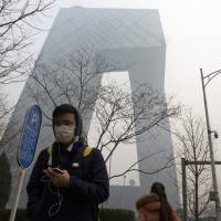 China, which emits pollutants that foul much of the air nationwide, plans to launch its first carbon-monitoring satellites next year. | AP