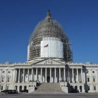 The U.S. Capitol in Washington, D.C., is seen in February American lawmakers voted overwhelmingly Tuesday to impose restrictions making it more difficult for visitors to Iraq, Syria and countries listed as supporting terrorism to travel visa-free to the United States. | AFP-JIJI