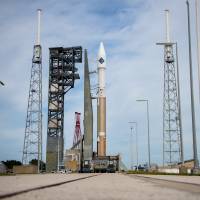 In this image released by NASA, an unmanned Atlas V rocket sits on the launchpad Wednesday at Cape Canaveral, Florida. The rocket is due to lift off early Thursday evening with 7,400 pounds of supplies for the International Space Station. Launch set to deliver food, supplies to ISS after months of accident-plagued delays