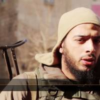 A file image grab taken from a video uploaded in February by Al-Hayat Media Centre allegedly shows French jihadi Salim Benghalem speaking in a TV report from Aleppo, titled \"Inside Halab.\" A trial of members of a network sending French jihadis to Syria opened in Paris on Tuesday without the main defendant, Salim Benghalem, who is believed to be fighting with the Islamic State group in the war-battered country. | AL HAYAT MEDIA CENTRE  / HO / AFP-JIJI