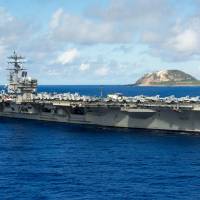 The USS Ronald Reagan is seen off Iwoto, Okinawa Prefecture, on Sept. 29, while on its way to the U.S. naval base at Yokosuka, Kanagawa Prefecture. | NAVY MEDIA CONTENT SERVICES