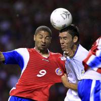 Costa Rica\'s Alvaro Saborio (left) fights for the ball with El Salvador\'s Alfredo Pacheco during their 2014 World Cup qualifying soccer match at the national stadium in San Jose on June 8, 2012. Pacheco, who played for the Salvadoran national side before being banned from the sport for life for his involvement in match-fixing, was murdered on Sunday. | REUTERS