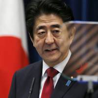 Prime Minister Shinzo Abe speaks during a recent news conference at his office in Tokyo. | AP