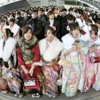 New adults attend a Coming of Age ceremony in Kobe last January. | KYODO