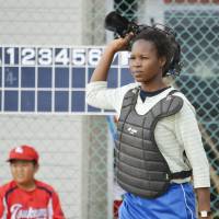 Zida Eugenie serves as chief umpire at a youth baseball game in Shibetsu, Hokkaido, on Sept. 26. | KYODO