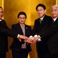 (From left) Indonesian Defense Minister Ryamizard Ryacudu, Indonesian Foreign Minister Retno Marsudi, Japanese Foreign Minister Fimio Kishida and Japanese Defense Minister Gen Nakatani prepare to kick off the first-ever two-plus-two meeting of Indonesian and Japanese foreign and defense ministers in Tokyo on Thursday. | AFP-JIJI