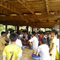 Villagers in Savannakhet Province, central Laos, hold a community meeting to discuss the preservation of natural resources in the area. Japan-based aid group sets up fish, timber projects in rural Laos