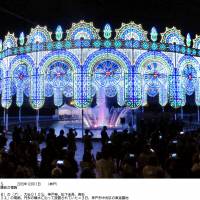 A decorative display that collapsed Friday at the Kobe Luminarie light show is shown illuminating a fountain on Dec. 3. | KYODO