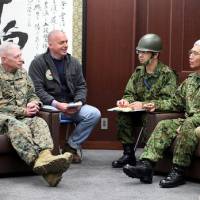Lt. Gen. Eiji Kimizuka (right) discusses the joint Japan-U.S. response to the Great East Japan Earthquake with U.S. Marine Corps Lt. Gen. Kenneth J. Glueck Jr. at Ground Self-Defense Force Camp Sendai in Miyagi Prefecture on March 15, 2011. | U.S. MARINE CORPS