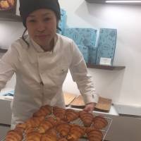 Staff at Rituel Par Christophe Vasseur hand out croissants. |  MIO YAMADA