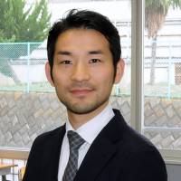 Kazuya Takahashi, an English teacher at Kogakuin University Junior and Senior High School in Hachioji, Tokyo, is pictured in a classroom on Dec. 15. Teacher champions critical thinking, a global perspective for students
