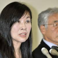 An Irie, a sister of murder victim Yasuko Miyazawa, holds a news conference Monday in Tokyo after filing a complaint over a TV Asahi program on the unsolved case. | KYODO
