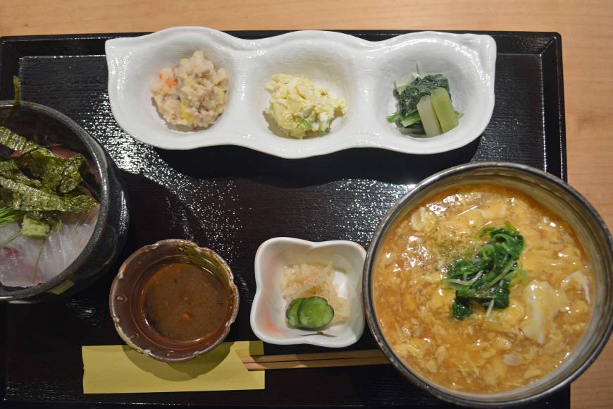 Sakuya Tres chic: Lunch at Sakuya is served all at once on a lacquered tray, and includes (left to right) kaisendon (seafood rice bowl), vegetable appetizers and ankake udon (wheat noodles in a thickened broth). | J.J. O'DONOGHUE