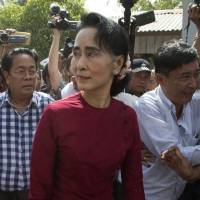 National League for Democracy leader Aung San Suu Kyi visits a polling station on the outskirts of Yangon in November. | AP