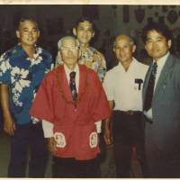 Tracing ties: The author’s issei great-great-grandfather (second left), pictured with his nisei son (center) and relatives in Hawaii. For Nikkei, Christmas is a time for family — and <em>rūtsu sagashi</em>