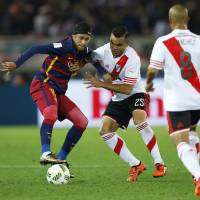 Barcelona\'s Neymar tries to control the ball against River Plate on Sunday. | REUTERS