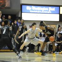 George Washington forward Yuta Watanabe, seen playing defense against Virginia Commonwealth University during his 2014-15 freshman season, has started all 11 Colonials games as a sophomore. | GW ATHLETICS