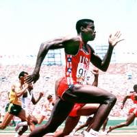 American Carl Lewis, who won 10 Olympic medals (nine gold) over the years, is captured on film during the 1984 Los Angeles Summer Games. | MARK SHEARMAN