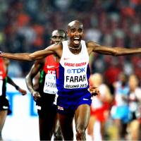 Great Britain\'s Mo Farah celebrates his triumph in the men\'s 10,000 meters at the 2015 IAAF World Championships in Beijing. | MARK SHEARMAN