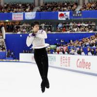 Olympic champion Yuzuru Hanyu added to his place in the records books by setting three world marks on the way to victory at the NHK Trophy in Nagano over the weekend. | KYODO