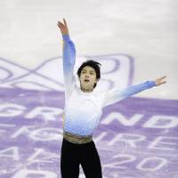 Olympic champion Yuzuru Hanyu made history by winning the Grand Prix Final for the third straight year and setting three more world records over the weekend in Barcelona, Spain. | AP