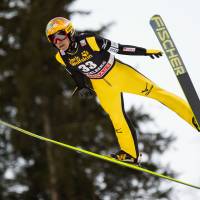 Ski jumper Noriaki Kasai soars through the air during a World Cup event on Saturday in Engelberg, Switzerland. | KYODO