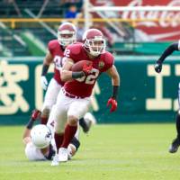Ritsumeikan University running back Nanato Nishimura carries the ball during the Panthers\' 28-27 win over Waseda University in the Koshien Bowl on Sunday in Nishinomiya, Hyogo Pref. | KAZ NAGATSUKA