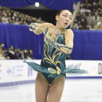 Rika Hongo skates at Makomanai Ice Arena on Saturday in the women\'s short program. She\'s in second place with 68.39 points. | KYODO