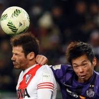 River Plate\'s Rodrigo Mora (left) vies for the ball against Sanfrecce\'s Tsukasa Shiotani during their Club World Cup semifinal match on Wednesday in Osaka | AFP-JIJI