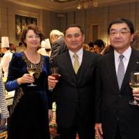 Kazakhstan Ambassador Akylbek Kamaldinov (second from right) and his wife, Olga (second from left) raise their glasses with Aiko Shimajiri, state minister for Okinawa and Northern Territories affairs, minister in charge of science and technology, space policy and territorial issues (left) and Michihiko Ota, co-chairman of the Japan-Kazakhstan Economic Committee and vice chairman of Marubeni Corp., during a reception celebrating the country\'s Independence Day at the Hotel Okura Tokyo on Dec. 14. | YOSHIAKI MIURA