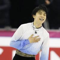 Olympic champion figure skater Yuzuru Hanyu broke his own world record, set two weeks ago at the NHK Trophy in Nagano, in Thursday\'s short program with 110.95 points at the Grand Prix Final in Barcelona, Spain. | KYODO