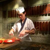 Front-row seat: Sitting at the counter, you can watch the chef at work, deftly picking out the ingredients, slicing them, and arranging each order on the plate.  | ROBBIE SWINNERTON