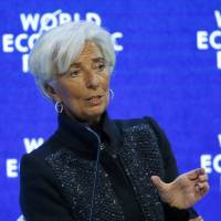 Christine Lagarde, Managing Director of the International Monetary Fund, attends \"The Global Economic Outlook\" session during the annual World Economic Forum in Davos, Switzerland, on Saturday. | REUTERS