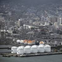 Oil tanks stand at a refinery in the Shunan industrial complex in Shunan, Yamaguchi Prefecture, in July. | BLOOMBERG