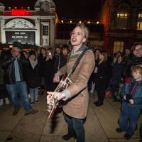 A fan sings Bowie songs to crowds outside the Ritzy cinema in Brixton. | AFP-JIJI