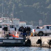A coast guard vessel arrives with the bodies of migrants at the port of Vathi on the eastern Greek island of Samos on Thursday. Authorities in Greece have raised the death toll from a migrant boat sinking to 18, after recovering seven more bodies off the island of Samos in the eastern Aegean Sea. | AP