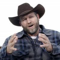Ammon Bundy speaks during an interview earlier this month at the Malheur National Wildlife Refuge near Burns, Oregon. Authorities said Tuesday that Bundy, leader of an armed Oregon group at the refuge, had been arrested. | AP