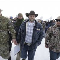 Protest leader Ammon Bundy departs after addressing the media at the Malheur National Wildlife Refuge near Burns, Oregon, on Monday. | AP