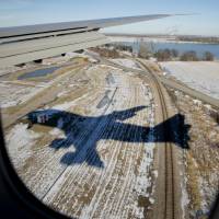 Air Force One, with President Barack Obama aboard, approaches Offutt Air Force Base in Bellevue, Nebraska, Wednesday. | AP