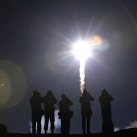A Soyuz rocket blasts off for the International Space Station from the Baikonur cosmodrome in Kazakhstan in March 2014. Cash-strapped Russia considers 30% cut to its space program