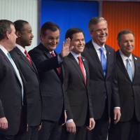Presidential hopefuls (from left) Rand Paul, Chris Christie, Ben Carson, Ted Cruz, Marco Rubio, Jeb Bush and John Kasich arrive for the Republican candidates\' debate in Des Moines, Iowa, on Thursday. | BLOOMBERG