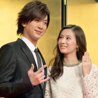 Singer Daigo and actress Keiko Kitagawa pose for photos after announcing their marriage at a news conference in Tokyo on Monday. | KYODO
