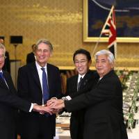 British Defense Secretary Michael Fallon (left), Foreign Secretary Philip Hammond and Japanese counterparts Foreign Minister Fumio Kishida and Defense Minister Gen Nakatani shake hands before their \"two-plus-two\" meeting at the Iikura guest house in Tokyo on Friday. | REUTERS