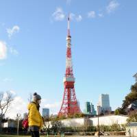 People stroll through Shiba Park in Minato Ward, Tokyo, on Wednesday. The ward plans to introduce new building regulations to preserve the views of Tokyo Tower. Minato Ward to protect few remaining views of Tokyo Tower