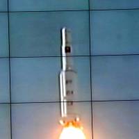 A Unha-3 rocket, carrying the satellite Kwangmyongsong-3, is monitored on screen at a satellite control center in Cholsan County, North Pyongan province, in this photo from North Korea\'s official Korean Central News Agency on Dec. 12, 2012. | AFP-JIJI
