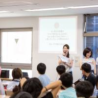 Asuka Someya delivers a lecture about safe sex in front of young people as part of a distance-learning course conducted at a high school in Tokyo. | COURTESY OF ASUKA SOMEYA