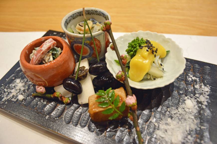 Rikyu Bricolage of flavor: A selection of salads accompanied by a sprig of cherry blossom — a hint of the warm weather to come. | J.J. O'DONOGHUE