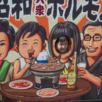A young visitor peeps into a world of good food. | STEPHEN MANSFIELD