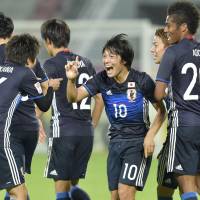 Shoya Nakajima (10) notched a pair of extra-time goals as Japan defeated Iran 3-0 in the quarterfinals of the Asian Under-23 Championships on Friday in Doha. | KYODO